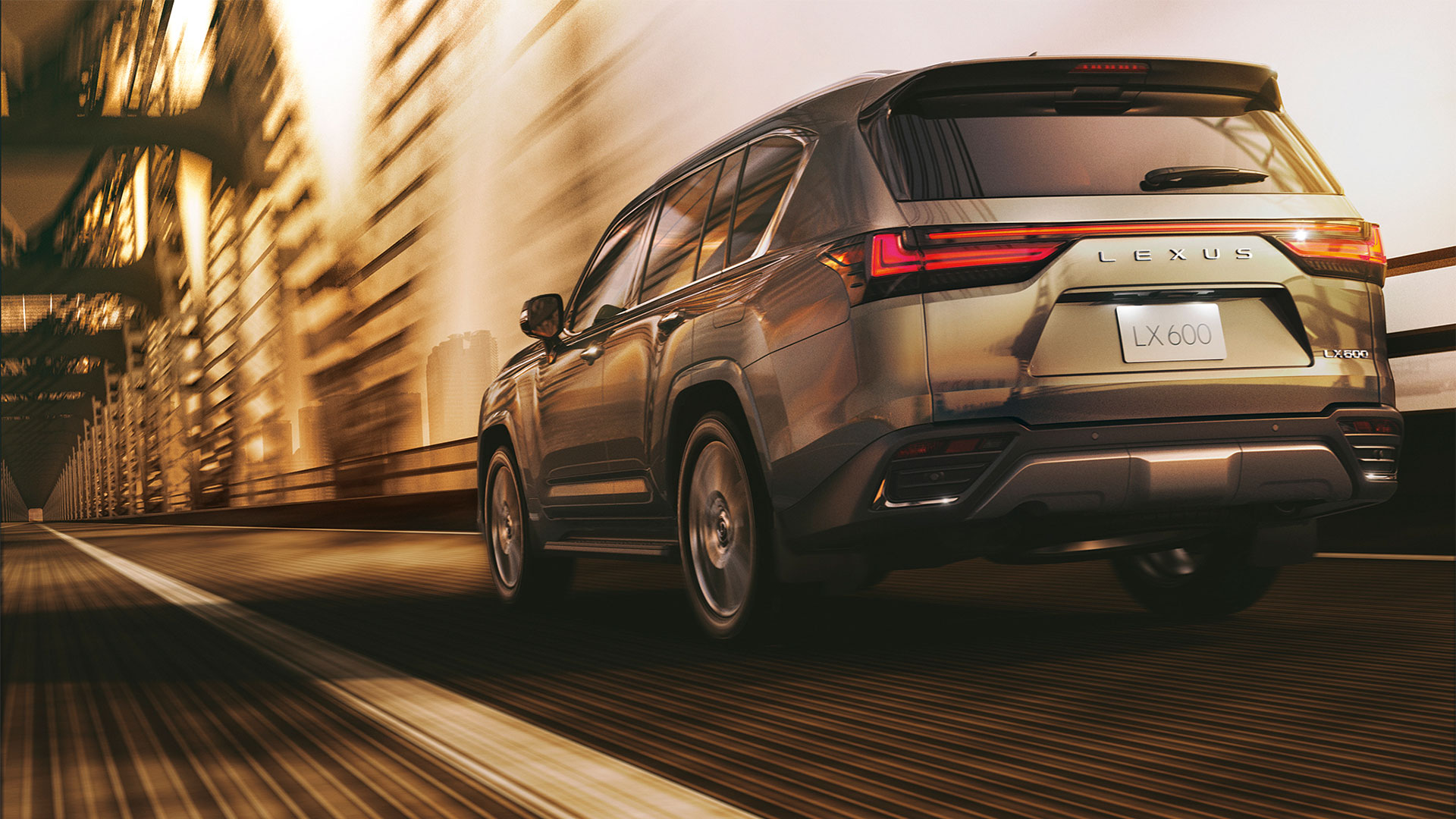 Lexus LX 600 driving on a city bridge